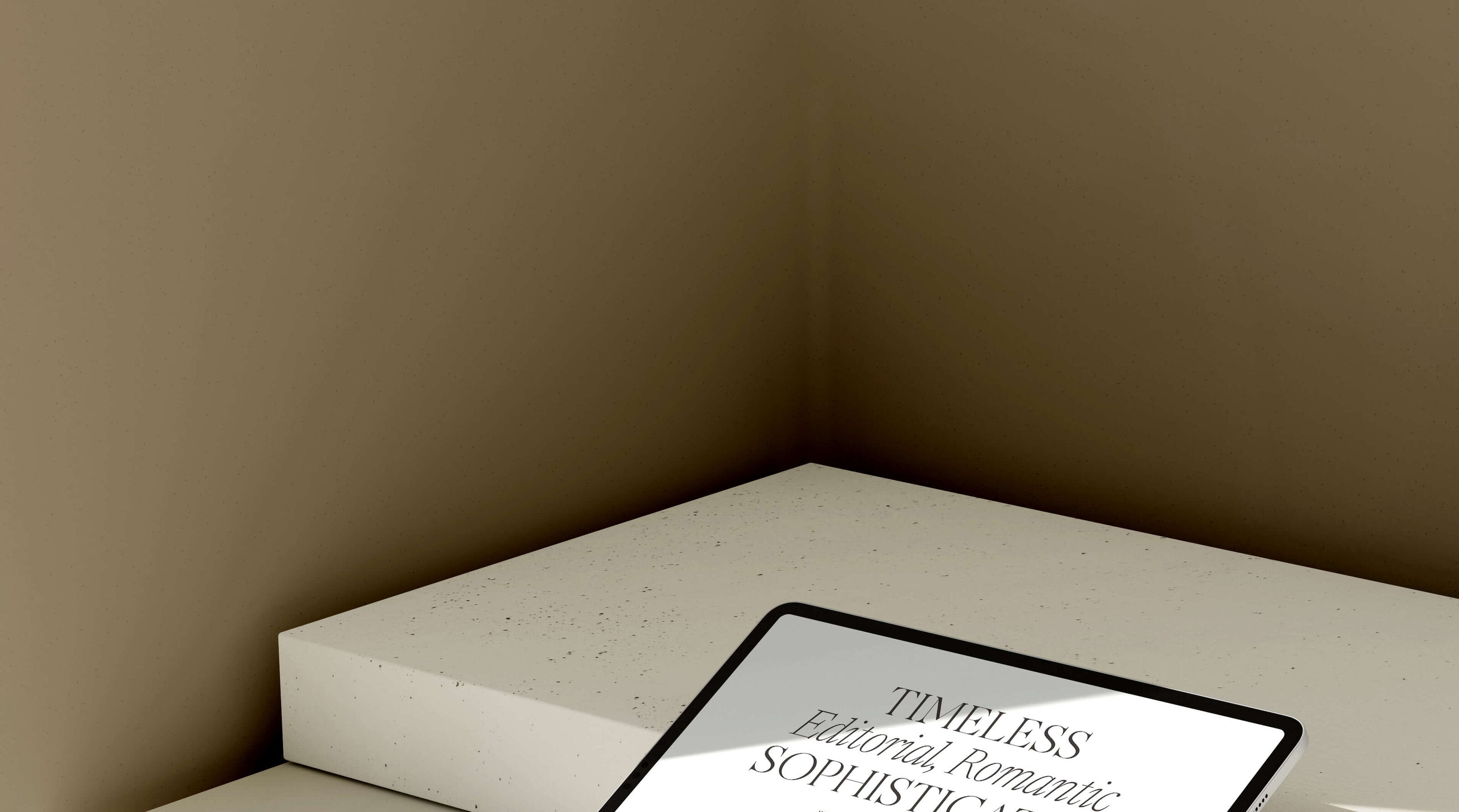 Tablet displaying a magazine layout on a white surface with a beige wall background