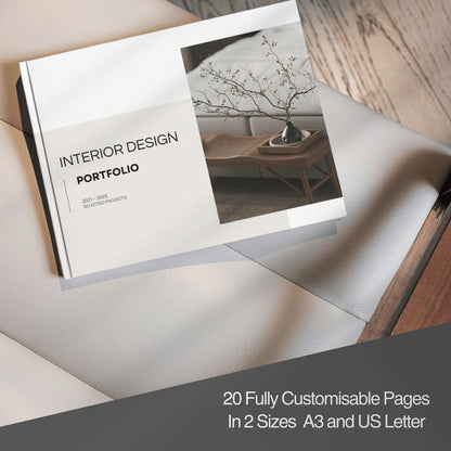 Interior design portfolio book on a wooden surface with text about customizable pages.