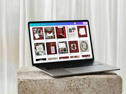 Laptop on a stone surface with a white curtain background