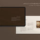 iPad displaying a design document on a brown background