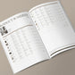 Open product schedule book on a beige background